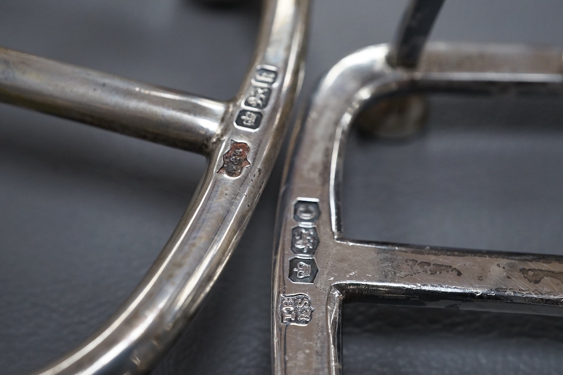 An Edwardian silver seven bar toast rack, by Mappin & Webb, Sheffield, 1902, 15.7cm, together with a George V smaller five bar toast rack, Thomas Bradbury & Sons, Sheffield, 1920, 15.6oz.